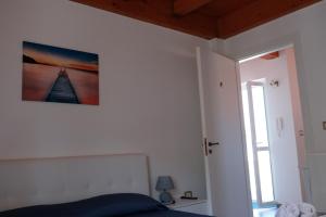 Postel nebo postele na pokoji v ubytování Residence Nina