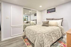 a bedroom with a bed and a mirror at Saddle Brook Studio with Patio - Near NYC! in Saddle Brook