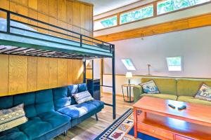 a living room with a couch and a bunk bed at Spacious Albrightsville Home with Game Room! in Albrightsville