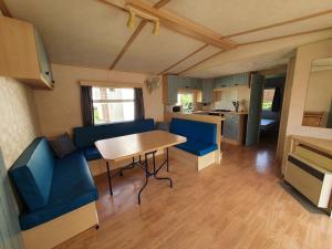 Posezení v ubytování Camping Familial paisible avec piscine, mobil home , chalet, Studio & emplacement nue