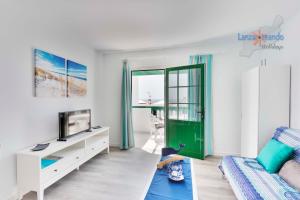 TV a/nebo společenská místnost v ubytování Vivienda Vacacional Casita del Mar