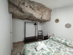 Cama o camas de una habitación en Casa Cueva EL PORTÓN