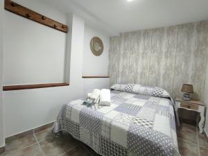 Cama o camas de una habitación en Casa Cueva EL PORTÓN