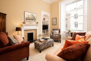 a living room filled with furniture and a fireplace at Linen House in Kelso