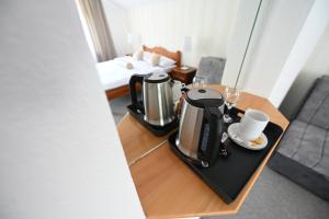 a coffee maker on a table in a room at Sobe - Rooms Drvorez in Banja Luka +16 photos