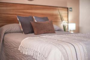 Postel nebo postele na pokoji v ubytování Hotel el Leñador