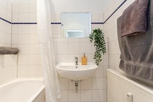 Koupelna v ubytování FULL HOUSE Studios - Das Beschickbare Apartment
