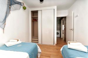 Łóżko lub łóżka w pokoju w obiekcie Suites At Sea II