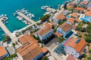 an aerial view of a harbor with boats at Irene Bed & Breakfast Tisno in Tisno