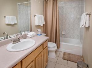 a bathroom with a sink and a toilet and a shower at Greenbrier Townhouse 36 in Avon +33 photos