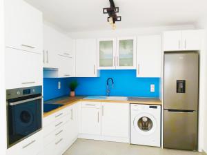 Kuchyň nebo kuchyňský kout v ubytování Gikas Apartments