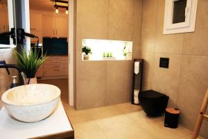 Ванна кімната в Gikas Apartments