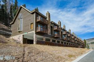 a building with balconies on the side of a hill at Cascade Village 50 Near Purgatory - Marmot Meadows Retreat in Durango Mountain Resort