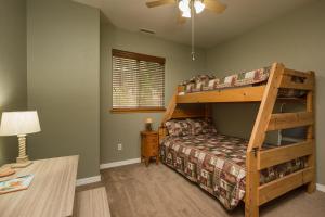 a bedroom with a bunk bed and a desk at 984 Pine Valley Forest Lakes in Vallecito