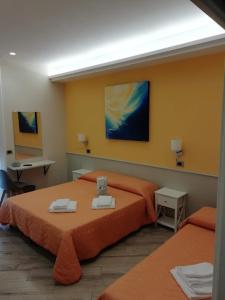 Postel nebo postele na pokoji v ubytování Oltre il Mare Guest House
