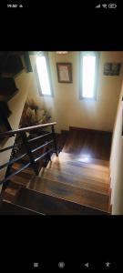 a room with stairs and windows in a building at Albergue de peregrinos Santa Marina in Molinaseca