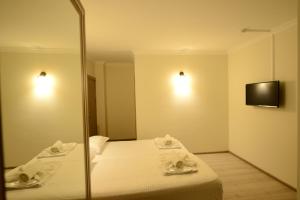 Postel nebo postele na pokoji v ubytování Hotel Dolphin Batumi