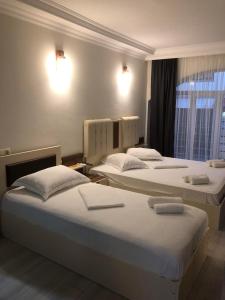 Postel nebo postele na pokoji v ubytování Hotel Dolphin Batumi