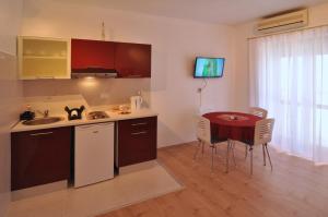 Kuchyň nebo kuchyňský kout v ubytování Apartment Nemo