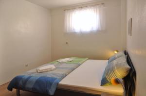 Postel nebo postele na pokoji v ubytování Apartment Nemo
