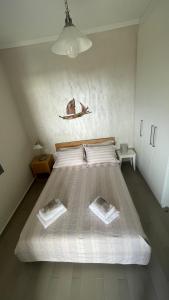 Posteľ alebo postele v izbe v ubytovaní Tzanetos Pelagos