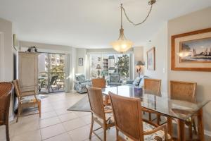 a dining room and living room with a table and chairs at 3321 Villamare in Hilton Head Island