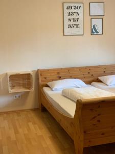 a bedroom with two beds and a air conditioner at das Eppelsheimer in Undenheim
