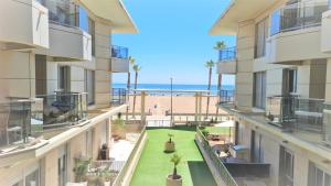 an apartment balcony with a view of the beach at BEACH VALENCIA LUXURY A40-13 Apartment with terrace and sea views in Valencia