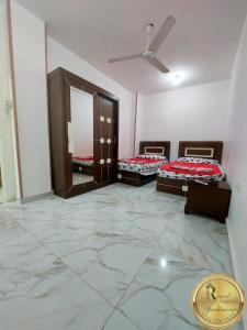 Letto o letti in una camera di Royal Apartments in Matrouh