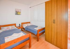 Postel nebo postele na pokoji v ubytování Rooms Oak Tree