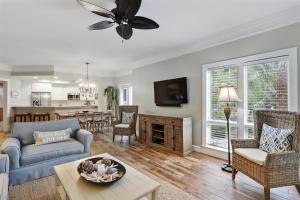 a living room with a couch and a table at 8121 Wendover Dunes in Hilton Head Island
