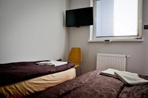 Llit o llits en una habitació de Apartament Wiosenna Kielce