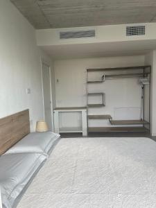 a bedroom with a large bed in a room at Guendalina Suite 2 in Verona