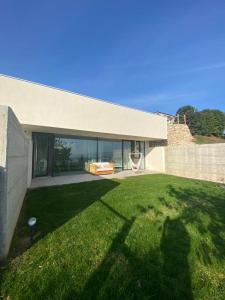a house with a large lawn in front of it at Guendalina Suite 2 in Verona