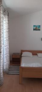 Łóżko lub łóżka w pokoju w obiekcie Villa Dobra Family Apartments