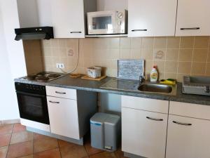 Kuchnia lub aneks kuchenny w obiekcie Villa Dobra Family Apartments