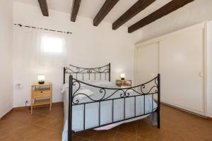 A bed or beds in a room at Holiday Home - Son Vida