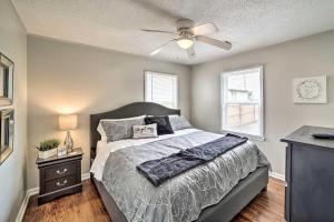 a bedroom with a bed and a ceiling fan at Adorable Tulsa Home Less Than 2 Mi to Expo Center! in Tulsa