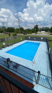 a large blue swimming pool on top of a building at KINGS INN in LaFayette