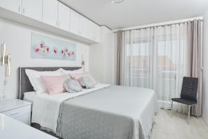 Posteľ alebo postele v izbe v ubytovaní Apartments Infinity