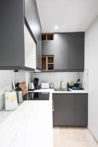 Köök või kööginurk majutusasutuses L'indiscrete Love Room - Hammam-Sauna-SPA