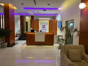 a lobby with a reception desk in a building at هاوس إن House Inn in Najran