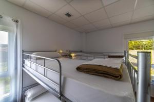 Posteľ alebo postele v izbe v ubytovaní Albergue Espiritu Xacobeo