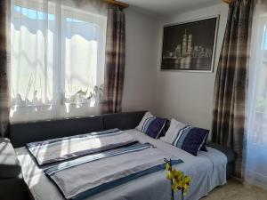 Ліжко або ліжка в номері Orchidea Apartment