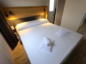 A bed or beds in a room at Garda Di Vino Agricamping & Wine Shop Lazise