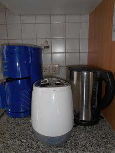 a kitchen counter with a toaster and a coffee maker at Wohnung Feuerberg mit Südbalkon in Ediger-Eller