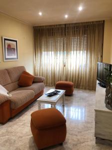 a living room with a couch and a coffee table at FIFA in Arzúa