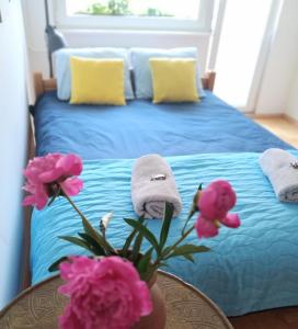 Posteľ alebo postele v izbe v ubytovaní roomsy Kolobrzeska