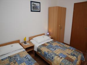 Postel nebo postele na pokoji v ubytování Apartments M&R ŠPADINA