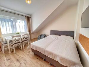 Postel nebo postele na pokoji v ubytování Niedaleko Morza